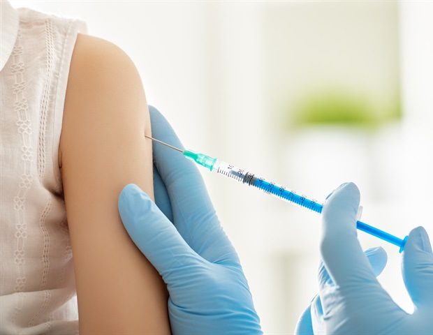 A doctor makes a vaccination to a child Yuganov Konstantin cdbf1b05417f45e89b8268af4858e1c9